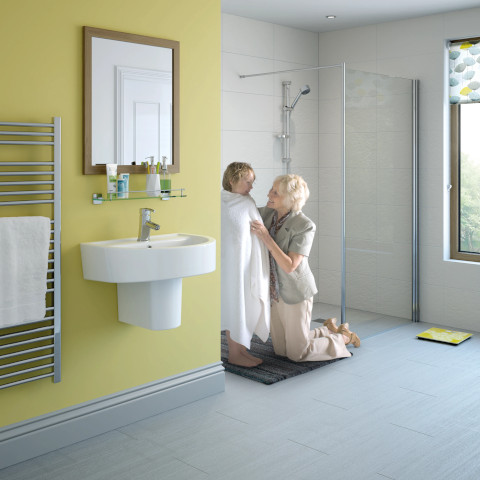 Modern walk-in shower in a Chichester home, featuring glass panels and tiled walls.
