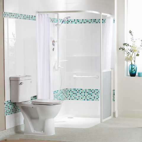 Step-free shower with a modern wall-mounted sink for space-saving design.